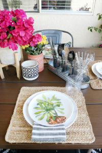 Galvanized metals, jute, mix and match pottery, and succulents make this casual outdoor entertaining space a hit.