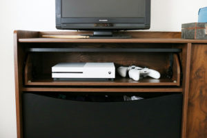 Teen Boy's Room Storage Solutions - Hide gaming consoles inside a credenza for a clean look.