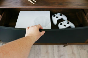 Teen Boy's Room Storage Solutions - Hide teens gaming systems in a console or credenza for easy clean up.