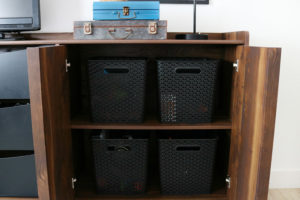 Teen Boy's Room Storage Solutions - utilize plastic storage bins to help keep things organized on shelves.