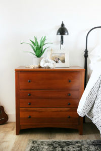 Boho Inspired Bedroom Nightstand Decor with Wall Sconce