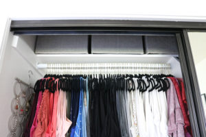 Easy Organization Idea - Utilize the top shelf for items that are less used, organize into fabric boxes for a clean look