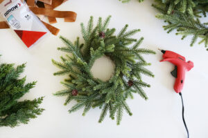 Turn Simple Holiday Wreaths Into A Modern Christmas Wall Hanging